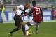 PARMA, ITALY - OCTOBER 27: Jonathan Biabiany of Parma FC competes for the ball with Kevin Constant of AC Milan during the Serie A match between Parma FC and AC Milan at Stadio Ennio Tardini on October 27, 2013 in Parma, Italy. (Photo by Marco Luzzani/Ge