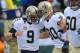 EAST RUTHERFORD, NJ - NOVEMBER 3: Quarterback Drew Brees #9 of the New Orleans Saints celebrates with tight end Jimmy Graham #80 of the New Orleans Saints after his touchdown catch in the 1st quarter against the New York Jets at MetLife Stadium on Novemb
