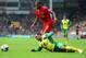 NORWICH, ENGLAND - APRIL 20: Nathan Redmond of Norwich City clashes with Glen Johnson of Liverpool during the Barclays Premier League match between Norwich City and Liverpool at Carrow Road on April 20, 2014 in Norwich, England. (Photo by Jamie McDonald