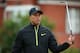 HOYLAKE, ENGLAND - JULY 15: Tiger Woods of the United States walks to a green during a practice round prior to the start of The 143rd Open Championship at Royal Liverpool on July 15, 2014 in Hoylake, England. (Photo by Andrew Redington/Getty Images)