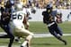 Aug 31, 2013; Morgantown, WV, USA; West Virginia Mountaineers running back Wendell Smallwood (4) carries the ball against the William & Mary Tribe during the fourth quarter at Milan Puskar Stadium. The West Virginia Mountaineers won 24-17. Mandatory Credi