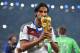 RIO DE JANEIRO, BRAZIL - JULY 13: Sami Khedira of Germany kisses the World Cup trophy after defeating Argentina 1-0 in extra time during the 2014 FIFA World Cup Brazil Final match between Germany and Argentina at Maracana on July 13, 2014 in Rio de Jane