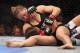 ANAHEIM, CA - FEBRUARY 23: Ronda Rousey hits Liz Carmouche during their UFC Bantamweight Title fight at Honda Center on February 23, 2013 in Anaheim, California. (Photo by Jeff Gross/Getty Images)