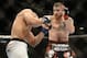 Dec 28, 2013; Las Vegas, NV, USA; Jim Miller (red gloves) and Fabricio Camoes (blue gloves) fight during their UFC lightweight bout at the MGM Grand Garden Arena. Mandatory Credit: Jayne Kamin-Oncea-USA TODAY Sports