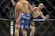 Jan 25, 2014; Chicago, IL, USA; Donald Cerrone (red gloves) kicks Adriano Martins (blue gloves) in the neck for a knock-out during UFC on FOX 10 at the United Center. Mandatory Credit: David Banks-USA TODAY Sports