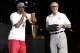 MIAMI, FL - JUNE 25: Dwyane Wade #3 of the Miami Heat speaks on stage as the Miami Heat President Pat Riley looks on during a rally for the 2012 NBA Champions Miami Heat at American Airlines Arena on June 25, 2012 in Miami, Florida. NOTE TO USER: User e