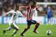 LISBON, PORTUGAL - MAY 24: Filipe Luis of Club Atletico de Madrid takes on Luka Modric of Real Madrid during the UEFA Champions League Final between Real Madrid and Atletico de Madrid at Estadio da Luz on May 24, 2014 in Lisbon, Portugal. (Photo by Laur