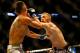 BOSTON, MA - AUGUST 17: Conor McGregor punches Max Holloway in their featherweight bout at TD Garden on August 17, 2013 in Boston, Massachusetts. (Photo by Jared Wickerham/Getty Images)
