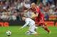 MADRID, SPAIN - APRIL 23: Arjen Robben of Bayern Muenchen takes on Sergio Ramos of Real Madrid during the UEFA Champions League semi-final first leg match between Real Madrid and FC Bayern Muenchen at the Estadio Santiago Bernabeu on April 23, 2014 in Ma