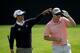AUGUSTA, GA - APRIL 08: Adam Scott of Australia jokes around with Justin Rose of England after Rose skipped a ball across the 16th hole during a practice round at Augusta National Golf Club on April 8, 2014 in Augusta, Georgia. (Photo by Ezra Shaw/Getty