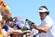 HOYLAKE, ENGLAND - JULY 15: Phil Mickelson of the United States signs autographs for fans during a practice round prior to the start of The 143rd Open Championship at Royal Liverpool on July 15, 2014 in Hoylake, England. (Photo by Stuart Franklin/Getty