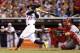 Jul 15, 2014; Minneapolis, MN, USA; American League infielder Jose Altuve (27) of the Houston Astros drives in a run with a sacrifice fly in the 5th inning during the 2014 MLB All Star Game at Target Field. Mandatory Credit: Jesse Johnson-USA TODAY Sports