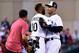 Jul 15, 2014; Minneapolis, MN, USA; American League infielder Alexei Ramirez (10) of the Chicago White Sox hugs infielder Derek Jeter (right) of the New York Yankees as Ramirez replaces Jeter in the field in the fourth inning during the 2014 MLB All Star