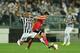 TURIN, ITALY - MAY 01: Arturo Vidal (L) of Juventus tackles Andre Gomes
of SL Benfica during the UEFA Europa League semi final match between Juventus and SL Benfica at Juventus Arena on May 1, 2014 in Turin, Italy. (Photo by Valerio Pennicino/Getty Ima