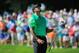BETHESDA, MD - JUNE 26: Tiger Woods of the United States reacts to his approach shot on the 17th hole during the first round of the Quicken Loans National at Congressional Country Club on June 26, 2014 in Bethesda, Maryland. (Photo by Rob Carr/Getty Ima