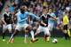 MANCHESTER, ENGLAND - APRIL 05: Yaya Toure of Manchester City and Steven Davis of Southampton compete for the ball during the Barclays Premier League match between Manchester City and Southampton at Etihad Stadium on April 5, 2014 in Manchester, England.