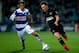 LONDON, ENGLAND - MARCH 25: Josh McEachran of Wigan Athletic is challenged by Niko Kranjcar of Queens Park Rangers during the Sky Bet Championship match between Queens Park Rangers and Wigan Athletic at Loftus Road on March 25, 2014 in London, England.