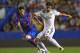 VALENCIA, SPAIN - OCTOBER 05: Sami Khedira of Real Madrid competes for the ball with Ruben of Levante during the La Liga match between Levante UD and Real Madrid at Ciutat de Valencia on October 5, 2013 in Valencia, Spain. (Photo by Manuel Queimadelos A