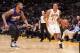 LOS ANGELES, CA - MARCH 30: Wesley Johnson #11 of the Los Angeles Lakers handles the ball against Marcus Morris #15 of the Phoenix Suns at STAPLES Center on March 30, 2014 in Los Angeles, California. NOTE TO USER: User expressly acknowledges and agrees th