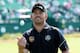 HOYLAKE, ENGLAND - JULY 15: Louis Oosthuizen of South Africa tosses a ball to the gallery during a practice round prior to the start of The 143rd Open Championship at Royal Liverpool on July 15, 2014 in Hoylake, England. (Photo by Andrew Redington/Getty