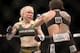Jul 16, 2014; Atlantic City, NJ, USA; Tina Lahdemaki (blue gloves) faces off against Claudia Gadelha (red gloves) during a 115-pound women's division bout at Revel Casino. Mandatory Credit: Bill Streicher-USA TODAY Sports