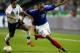 PARIS - APRIL 30: Thierry Henry of France skips Ahmed Fathy of Egypt during the International friendly match between France and Egypt on April 30, 2003 at The Stade de France in Paris, France. France won the match 5-0. (Photo by Clive Rose/Getty Image
