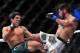 Feb 2, 2013; Las Vegas, NV, USA; Joseph Benavidez (left) and Ian McCall (right) exchange kicks during UFC 156 at the Mandalay Bay Events Center. Mandatory Credit: Gary A. Vasquez-USA TODAY Sports