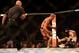 Jul 16, 2014; Atlantic City, NJ, USA; The referee comes over to break up the fight after Donald Cerrone (red gloves) knocks down Jim Miller (blue gloves) during a 5-round lightweight bout at Revel Casino. Mandatory Credit: Bill Streicher-USA TODAY Sports