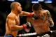 BOSTON, MA - AUGUST 17: Diego Brandao punches Daniel Pineda in their featherweight bout at TD Garden on August 17, 2013 in Boston, Massachusetts. (Photo by Jared Wickerham/Getty Images)