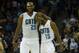 Mar 31, 2014; Charlotte, NC, USA; Charlotte Bobcats guard Kemba Walker (15) celebrates with center Al Jefferson (25) during the second half against the Washington Wizards at Time Warner Cable Arena. Bobcats defeated the Wizards 100-94. Mandatory Credit: J