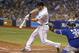 ST. PETERSBURG, FL - JULY 12: Ben Zobrist #18 of the Tampa Bay Rays hits a sacrifice fly to center field in front of catcher Dioner Navarro #30 of the Toronto Blue Jays to score teammate Yunel Escobar during the seventh inning of a game on July 12, 2014
