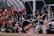 Pochettino and his coaching staff watching on during Southampton's 2013 pre-season opener against Llagostera.