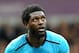 Emmanuel Adebayor misses out on Tottenham's North American tour after suffering with malaria.