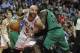Mar 31, 2014; Chicago, IL, USA; Chicago Bulls forward Carlos Boozer (5) is defended by Boston Celtics forward Brandon Bass (30) during the second half at the United Center. The Chicago Bulls defeated the Boston Celtics 94-80. Mandatory Credit: David Bank