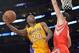 Apr 8, 2014; Los Angeles, CA, USA; Los Angeles Lakers guard Jodie Meeks (20) is defended by Houston Rockets forward Omri Casspi (18) at Staples Center. Mandatory Credit: Kirby Lee-USA TODAY Sports