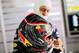 HOCKENHEIM, GERMANY - JULY 18: Sebastian Vettel of Germany and Infiniti Red Bull Racing holds his race helmet, which has been customised in celebration of the German national football team's World Cup victory, as he prepares in the garage during practice