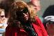 Oracene Price, Serena Williams' mom, appears concerned as she stands up in the player's box.