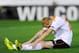 VALENCIA, SPAIN - MAY 01: Jeremy Mathieu of Valencia CF sits dejected on the pitch after Stephane Mbia of Sevilla scored his team's first goal during the UEFA Europa League Semi Final second leg match between Valencia CF and Sevilla FC at Estadi de Mesta