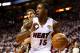 MIAMI, FL - JUNE 12: Mario Chalmers #15 of the Miami Heat drives to the basket against Tiago Splitter #22 of the San Antonio Spurs during Game Four of the 2014 NBA Finals at American Airlines Arena on June 12, 2014 in Miami, Florida. NOTE TO USER: User e