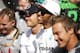 NORTHAMPTON, ENGLAND - JULY 06: Lewis Hamilton of Great Britain and Mercedes GP celebrates with his team including Nico Rosberg of Germany and Mercedes GP following his victory in the British Formula One Grand Prix at Silverstone Circuit on July 6, 2014