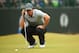 HOYLAKE, ENGLAND - JULY 19: Rory McIlroy of Northern Ireland lines up a putt during the third round of The 143rd Open Championship at Royal Liverpool on July 19, 2014 in Hoylake, England. (Photo by Mike Ehrmann/Getty Images)