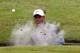 HOYLAKE, ENGLAND - JULY 19: Tiger Woods of the United States hits from a bunker on the 15th hole during the third round of The 143rd Open Championship at Royal Liverpool on July 19, 2014 in Hoylake, England. (Photo by Tom Pennington/Getty Images)