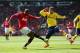 MANCHESTER, ENGLAND - MAY 03: Ashley Young of Manchester United gets in a shot past Marcos Alonso of Sunderland during the Barclays Premier League match between Manchester United and Sunderland at Old Trafford on May 3, 2014 in Manchester, England. (Pho