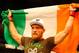 BOSTON, MA - AUGUST 17: Conor McGregor celebrates following his win against Max Holloway in their featherweight bout at TD Garden on August 17, 2013 in Boston, Massachusetts. (Photo by Jared Wickerham/Getty Images)
