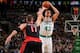 BOSTON, MA - MARCH 26: Kris Humphries #43 of the Boston Celtics shoots against Jonas Valanciunas #17 of the Toronto Raptors on March 26, 2014 at the TD Garden in Boston, Massachusetts. NOTE TO USER: User expressly acknowledges and agrees that, by downloa