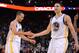 December 3, 2013; Oakland, CA, USA; Golden State Warriors point guard Stephen Curry (30, left) and shooting guard Klay Thompson (11) celebrate during the fourth quarter against the Toronto Raptors at Oracle Arena. The Warriors defeated the Raptors 112-103