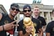 BERLIN, GERMANY - JULY 15: Jerome Boateng, Sami Khedira and Per Mertersacker celebrate during the German team victory ceremony on July 15, 2014 in Berlin, Germany. Germany won the 2014 FIFA World Cup Brazil match against Argentina in Rio de Janeiro on Ju