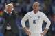 Hands on hips: Wayne Rooney fails to lead England again.