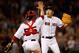 BOSTON, MA - JULY 19: Koji Uehara #19 of the Boston Red Sox reacts with Christian Vazquez #55 after the final out against the Kansas City Royals to give the Red Sox a 2-1 win at Fenway Park on July 19, 2014 in Boston, Massachusetts. (Photo by Jim Rogash