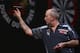 DUBAI, UNITED ARAB EMIRATES - MAY 29: Phil Taylor of England plays against Peter Wright of England during the 2014 Dubai Duty Free Darts Masters Quarter-Final match at Dubai Duty Free Tennis Stadium, Irish Village on May 29, 2014 in Dubai, United Arab E